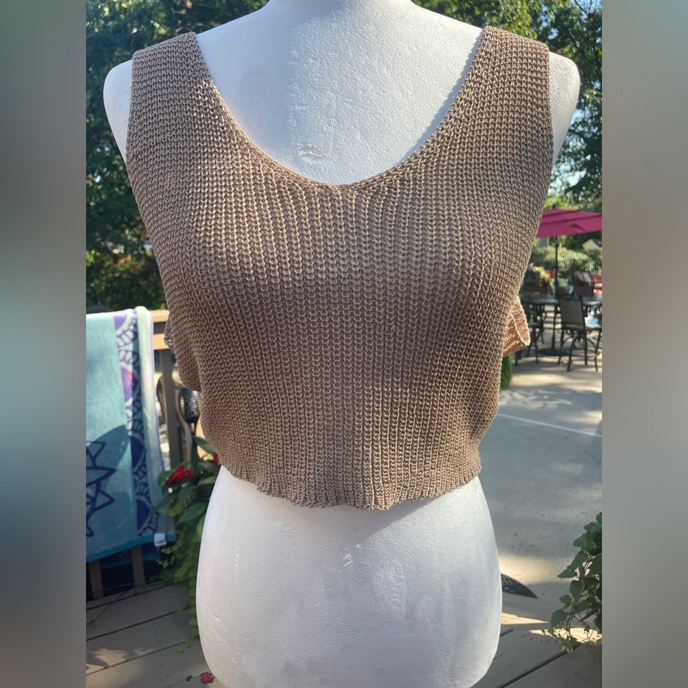 Very cute knit tank sweater. Color is tan/ beige. Brand Forever 21. Size L